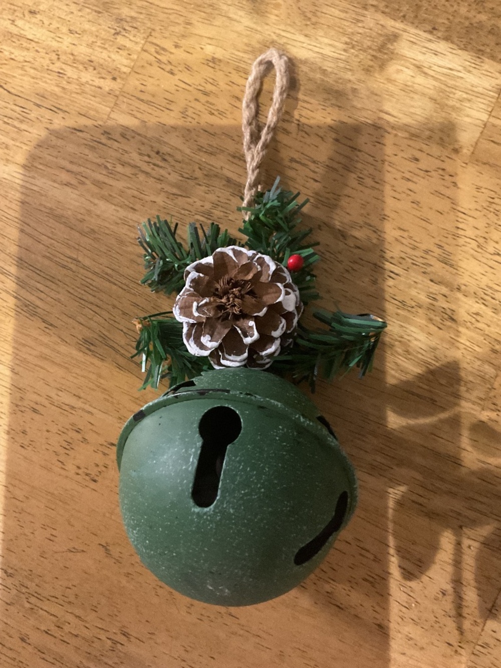 green metal Christmas jingle bell ornament